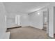 Bright bedroom with neutral carpeting and access to hallway at 803 E Valencia St, Lakeland, FL 33805