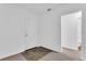Simple entryway with wood-look flooring and door to bathroom at 803 E Valencia St, Lakeland, FL 33805