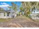 Side view of house showing backyard and additional parking at 803 E Valencia St, Lakeland, FL 33805