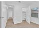 Hallway with carpet and access to bedrooms at 803 E Valencia St, Lakeland, FL 33805