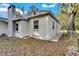 Side view of a newly renovated home showcasing a walkway and landscaping at 803 E Valencia St, Lakeland, FL 33805