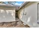 Side view of a newly renovated home showcasing the back door and utilities at 803 E Valencia St, Lakeland, FL 33805