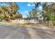 Front view of a newly renovated home on a tree-lined street at 803 E Valencia St, Lakeland, FL 33805
