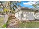 Side view of a newly renovated home with a fenced backyard at 803 E Valencia St, Lakeland, FL 33805