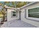 Front entrance of a newly renovated home with gray shutters at 803 E Valencia St, Lakeland, FL 33805