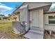Side view of a newly renovated home with AC unit and steps at 803 E Valencia St, Lakeland, FL 33805