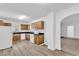 Galley kitchen with wood cabinets, granite countertops, and white appliances at 803 E Valencia St, Lakeland, FL 33805