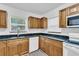 Modern kitchen with ample cabinetry and granite countertops at 803 E Valencia St, Lakeland, FL 33805