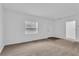 Bright and airy living room with neutral carpeting and an open floor plan at 803 E Valencia St, Lakeland, FL 33805