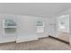 Living room with neutral carpeting and built-in shelving at 803 E Valencia St, Lakeland, FL 33805