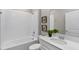 Bathroom with single vanity and shower/tub combo at 3141 Zuni Rd, St Cloud, FL 34771