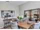 Elegant dining room with wood table and statement mirror at 3141 Zuni Rd, St Cloud, FL 34771