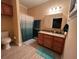 Bathroom with shower, vanity, and toilet at 4200 Joslyn Ln, Lady Lake, FL 32159