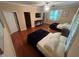 Guest bedroom with hardwood floors and two double beds at 4200 Joslyn Ln, Lady Lake, FL 32159