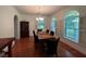 Formal dining room with hardwood floors and large windows at 4200 Joslyn Ln, Lady Lake, FL 32159