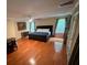 Spacious main bedroom with hardwood floors and large windows at 4200 Joslyn Ln, Lady Lake, FL 32159