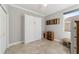 Well-lit bedroom featuring tile floors and ample closet space at 9849 Sw 99Th Loop, Ocala, FL 34481