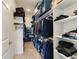 Large walk-in closet with ample shelving and hanging space at 9849 Sw 99Th Loop, Ocala, FL 34481