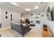 Spacious living room with a gray sofa and sliding glass doors leading to the outdoors at 9849 Sw 99Th Loop, Ocala, FL 34481