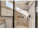 Walk-in shower with tiled walls and built-in seat at 9849 Sw 99Th Loop, Ocala, FL 34481