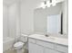Bathroom with modern vanity, tile flooring, subway tile in the shower, and recessed lights, offers a clean, bright space at 1258 Lakeridge Way, Lake Alfred, FL 33850