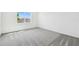 Bedroom featuring a carpeted floor, window, and white walls at 1258 Lakeridge Way, Lake Alfred, FL 33850