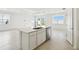 Kitchen island featuring stainless steel dishwasher, sink, and modern faucet at 1258 Lakeridge Way, Lake Alfred, FL 33850