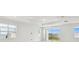 Spacious room filled with natural light from the large windows and sliding glass doors at 1258 Lakeridge Way, Lake Alfred, FL 33850