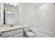 Clean bathroom featuring subway tile, vanity with sink, and a bathtub with shower at 1622 Ruby Ln, Lake Alfred, FL 33850