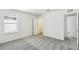 Bright bedroom with plush carpet, a window, closet and doors leading to other rooms at 1622 Ruby Ln, Lake Alfred, FL 33850