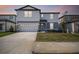 Charming two-story home with a well-manicured front lawn and inviting curb appeal at 1622 Ruby Ln, Lake Alfred, FL 33850
