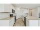 Modern kitchen featuring stainless steel appliances, stylish countertops, and ample cabinet space at 1622 Ruby Ln, Lake Alfred, FL 33850