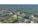 Aerial showcasing home's waterfront position and surrounding area at 4680 Poinciana Dr, Indian Lake Estates, FL 33855