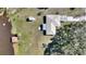 Overhead view of home, showcasing backyard, dock, and shed at 4680 Poinciana Dr, Indian Lake Estates, FL 33855
