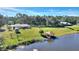 Property features a lakefront home with a gazebo and dock at 4680 Poinciana Dr, Indian Lake Estates, FL 33855