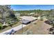 House with shed and expansive grassy area at 4680 Poinciana Dr, Indian Lake Estates, FL 33855