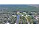Aerial view showing home's waterfront location and neighborhood at 4680 Poinciana Dr, Indian Lake Estates, FL 33855