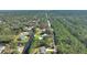Aerial view of property near water, showcasing its tranquil setting at 4680 Poinciana Dr, Indian Lake Estates, FL 33855