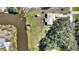 Aerial view of property featuring lake access with covered boat dock at 4680 Poinciana Dr, Indian Lake Estates, FL 33855