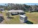 Backyard with shed and sunroom addition at 4680 Poinciana Dr, Indian Lake Estates, FL 33855