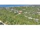 Aerial view of property showcasing waterfront access and large lot at 4680 Poinciana Dr, Indian Lake Estates, FL 33855