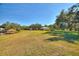 Large backyard with gazebo, shed and view of the canal at 4680 Poinciana Dr, Indian Lake Estates, FL 33855
