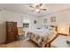 Bright bedroom featuring a comfortable bed and natural light at 4680 Poinciana Dr, Indian Lake Estates, FL 33855