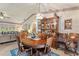 Charming dining room with wood table and hutch at 4680 Poinciana Dr, Indian Lake Estates, FL 33855