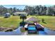 Private dock with gazebo on the water at 4680 Poinciana Dr, Indian Lake Estates, FL 33855