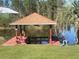 Private dock with gazebo on the lake at 4680 Poinciana Dr, Indian Lake Estates, FL 33855