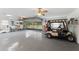 Spacious garage with golf cart and plenty of storage at 4680 Poinciana Dr, Indian Lake Estates, FL 33855