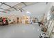 Garage with golf cart, laundry area, and storage at 4680 Poinciana Dr, Indian Lake Estates, FL 33855