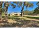 Charming single story home with large yard and mature trees at 4680 Poinciana Dr, Indian Lake Estates, FL 33855