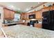 Modern kitchen with granite countertops and stainless steel appliances at 4680 Poinciana Dr, Indian Lake Estates, FL 33855